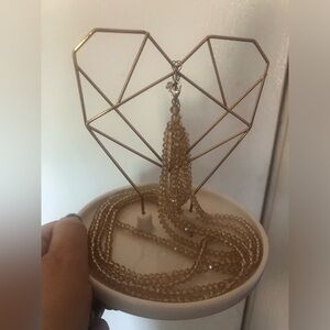 Heart shaped copper wire and ceramic jewlery holder or decoration.